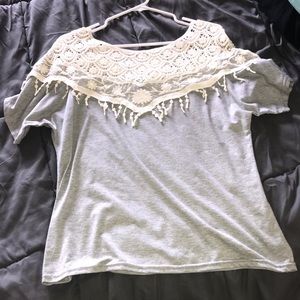 A never worn laced grey shirt